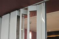 The FlexiGlide top track is bent or straight and can be recessed. Detail of a curved shutter top track.