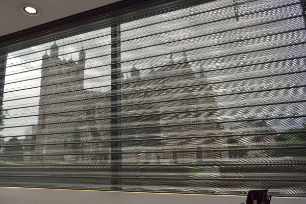 Exeter Catherdral seen through a perforated roller shutter curtain