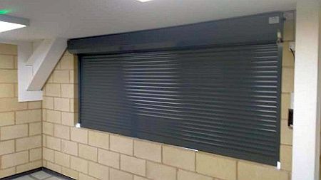 grey scurity shutter in servery wall