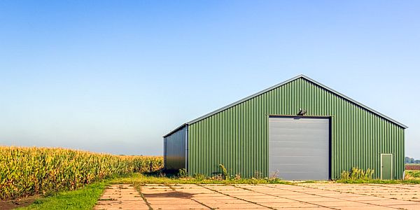 Farm building with security shutter and door