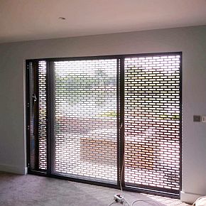slotted roller shutter seen from the inside of a room