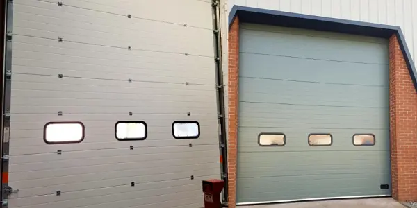 Internal and external view of a newly installed sectional overhead door