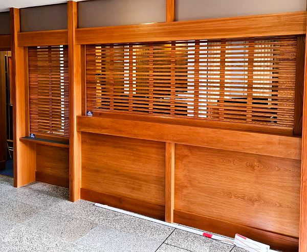 set of see-through timber roller shutters at reception