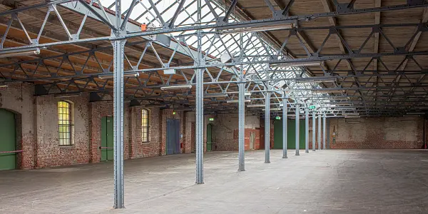 large open space in an old industrial warehouse