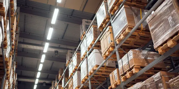 Pallets stacked high in an industrial warehouse