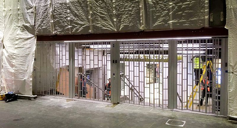 Sliding security shutter being installed at Waverley station in Edinburgh