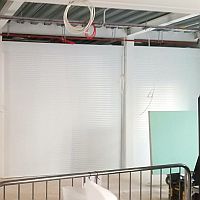 Frontview of a set of three roller shutters in Sidmouth College