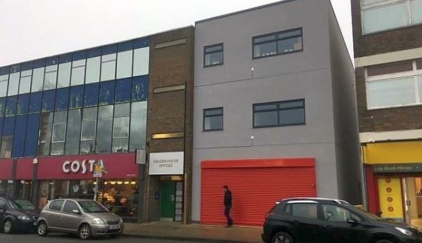 Red roller shutter on the retrospective building in Shipley